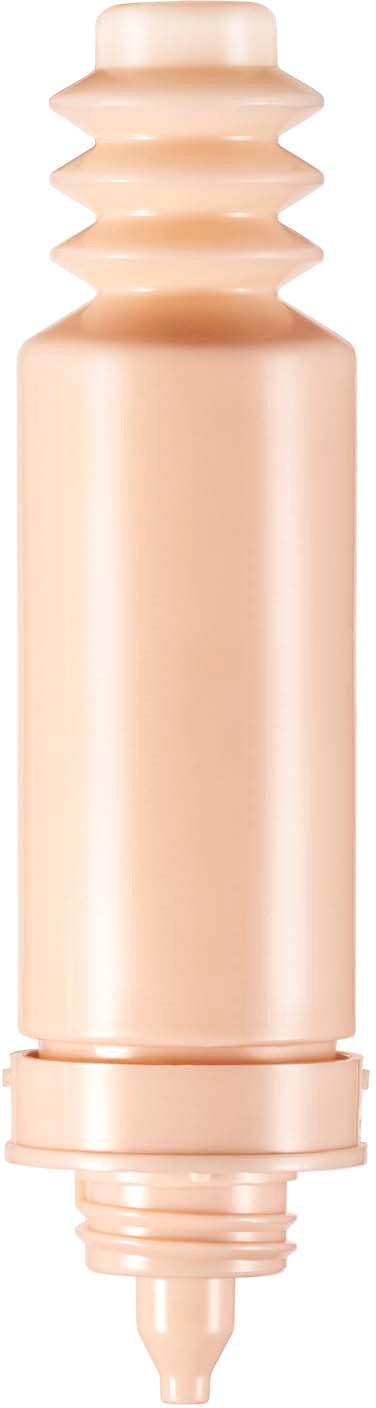 A beige electronic device with a ribbed top and a smooth cylindrical body.