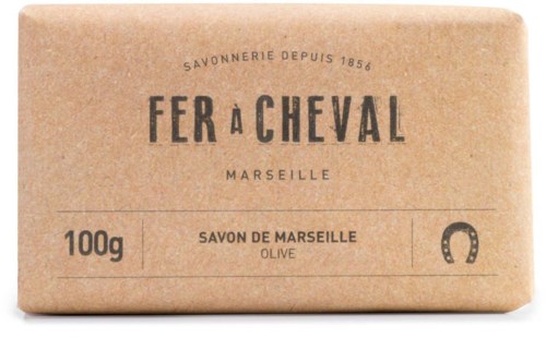 A beige soap bar with black text and a horseshoe symbol, labeled 'Savon de Marseille' and made with olive oil.
