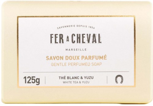 A soap box with the brand name 'Fer à Cheval' from Marseille, scented with white tea and yuzu, weighs 125g.