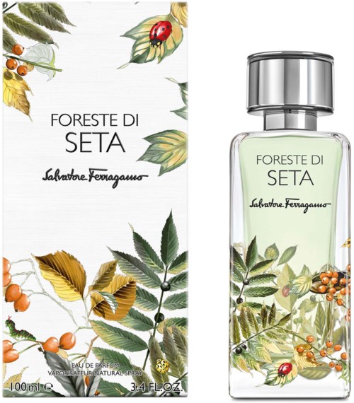 Hajuvesipullo ja laatikko, joissa on lehtiä, marjoja ja muurahaiskärpänen, nimeltä Foreste di Seta by Salvatore Ferragamo.