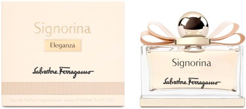 Hajuvesipullo ja laatikko nimeltä Signorina Eleganza, kultainen ja beige värejä, ja rusetti koriste.