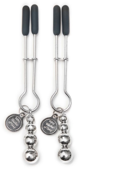 Zwei Metallwerkzeuge mit schwarzen Griffen und hängenden Silberkugeln, möglicherweise für Haar- oder Körperschmuck oder Dekoration.
