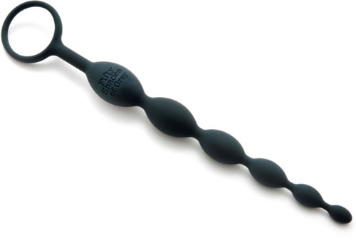 Ein flexibles schwarzes Werkzeug mit runder, spiralförmiger Endung, geeignet zum Reinigen oder Kratzen.