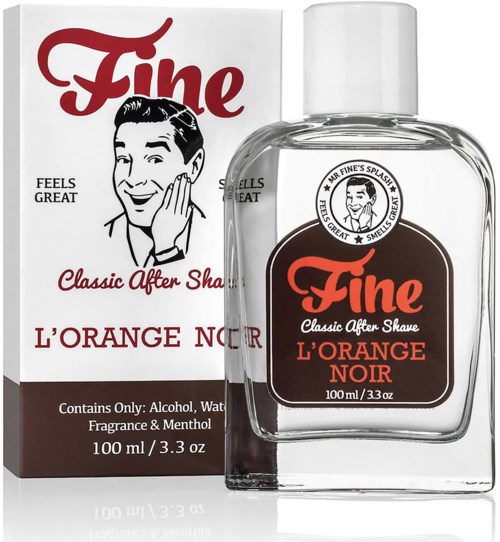 A bottle of after shave labeled 'Fine L'Orange Noir' with a vintage design and a cartoon man on the box.