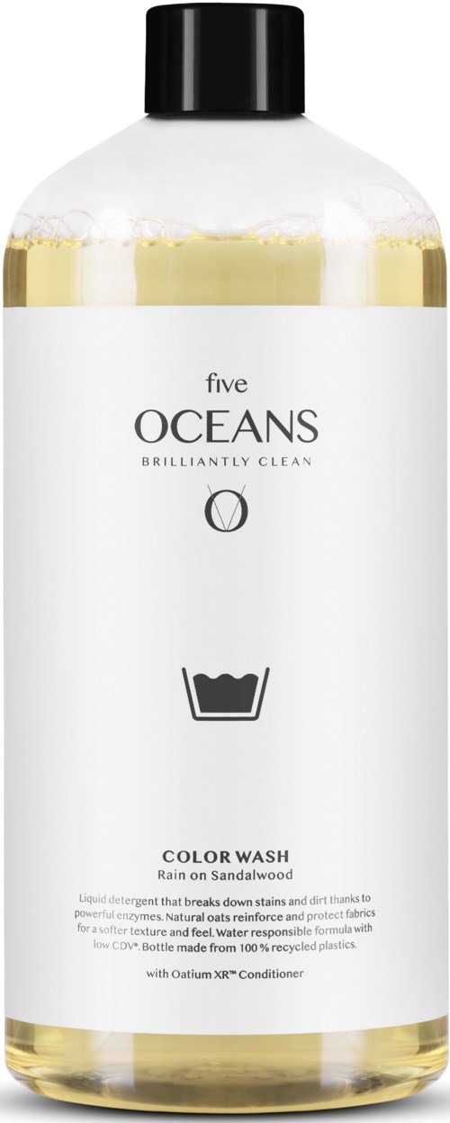 A white bottle with a black cap, labeled Five Oceans color wash for hair, with a washing symbol and description.