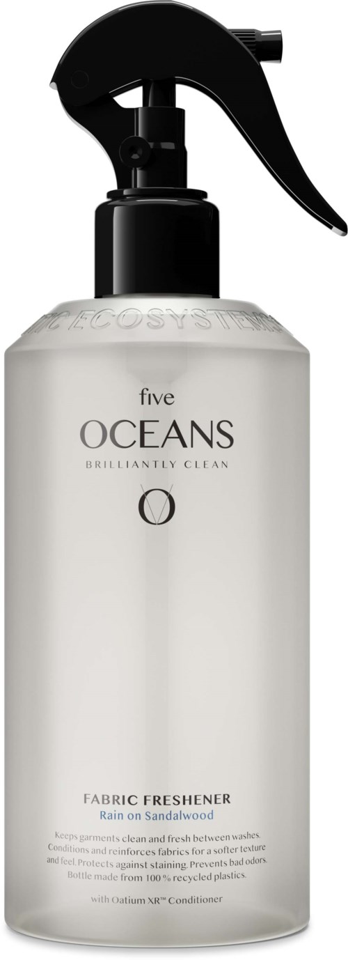 A white bottle with a black spray nozzle, labeled 'five OCEANS fabric freshener' for cleaning and freshening fabrics.