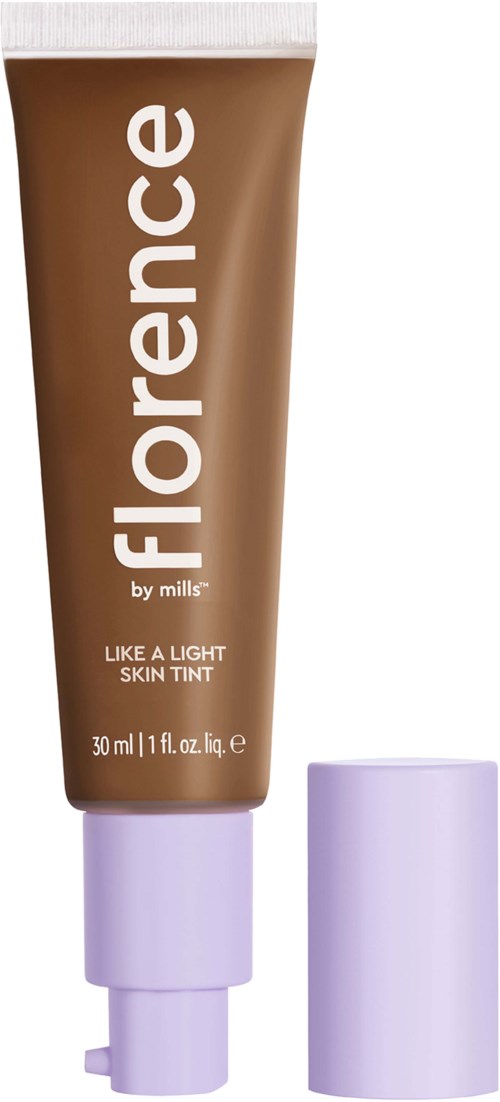 Ett brunt tub som är märkt 'Florence by mills' med ett vitt lock, innehållande en ljus hudfärg.