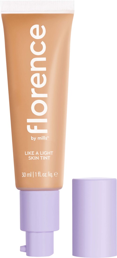 En persikfärgad tub märkt 'FLORENC' med vitt text och lila lock bredvid. Det är en hudton.