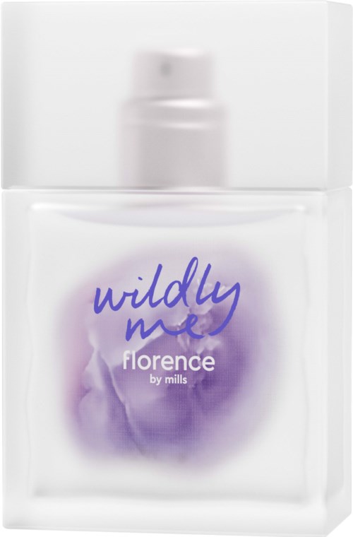 En vit flaska märkt 'Wildly Me Florence by Mills' med lila design, troligen en hudvårds- eller kosmetikprodukt.