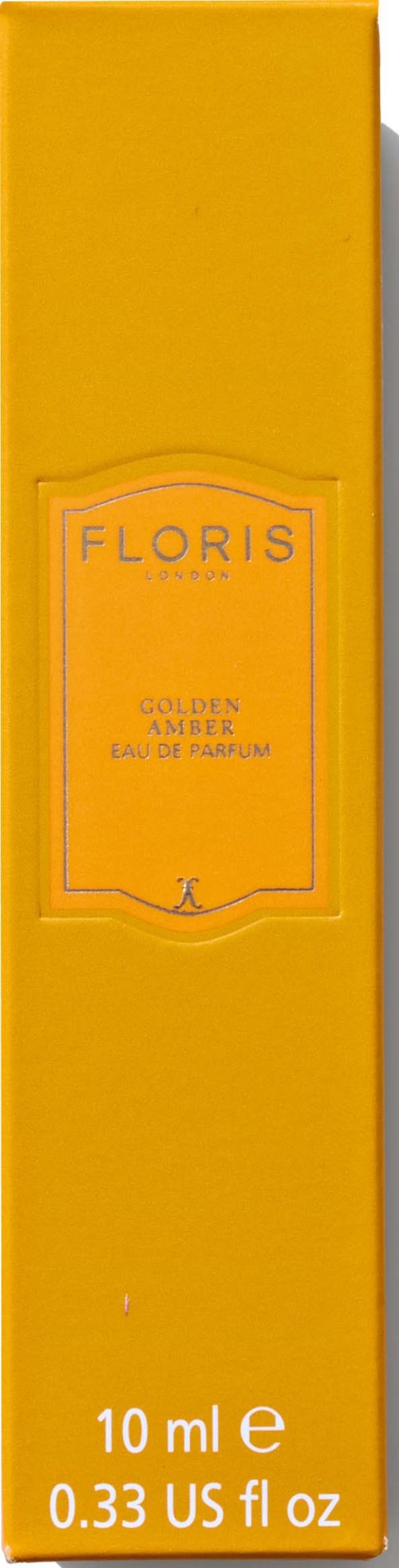 Een geel doosje met de merknaam Floris en woorden 'Golden Amber', wat wijst op een parfumfles.