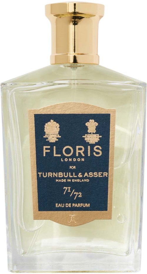 Eine klare Parfümflasche mit goldener Kappe, Beschriftung zeigt Marke Floris, Duft für Männer, schlichtes elegantes Design.