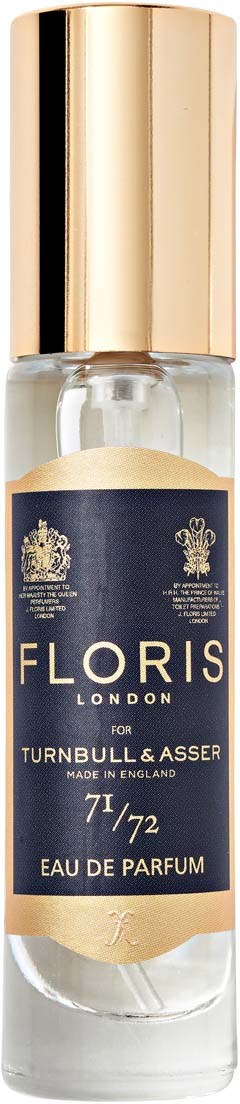 Eine klare Parfümflasche mit goldener Kappe und dunkelblauem Etikett, beschriftet Floris London für Turnbull & Asser, Eau de Parfum.