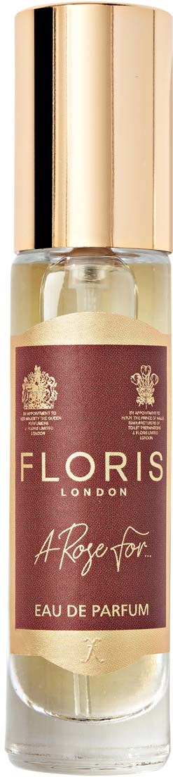 Eine kleine Parfüfflasche mit goldenem Deckel und einem dunkelroten Etikett, das 'Floris London' und 'A Rose For' sagt.