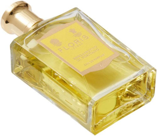 Een parfumfles met gele vloeistof en een gouden dop, gelabeld Flouris, Biologico, Portugal, 100 ml.