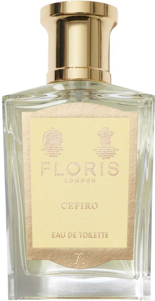 A clear perfume bottle with a gold cap and a cream-colored label. It is labeled 'Floris Cefiro Eau de Toilette.'