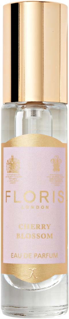 Eine kleine Parfümflasche mit Goldkappe und rosa Etikett. Es ist mit Flori Cherry Blossom Eau de Parfum beschriftet.