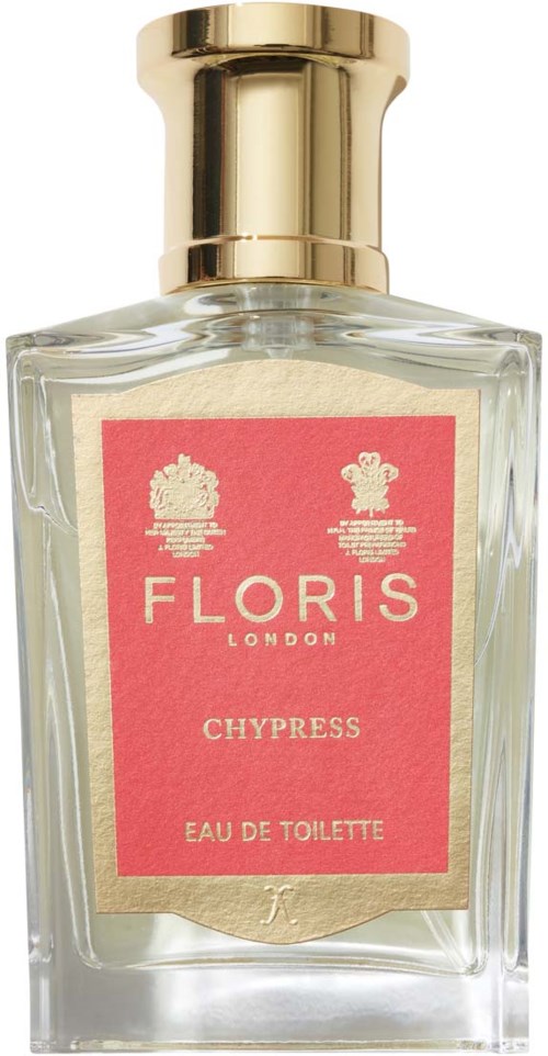 Een heldere glazen fles met gouden dop, bevat parfum 'Floris Chypress Eau de Toilette'.