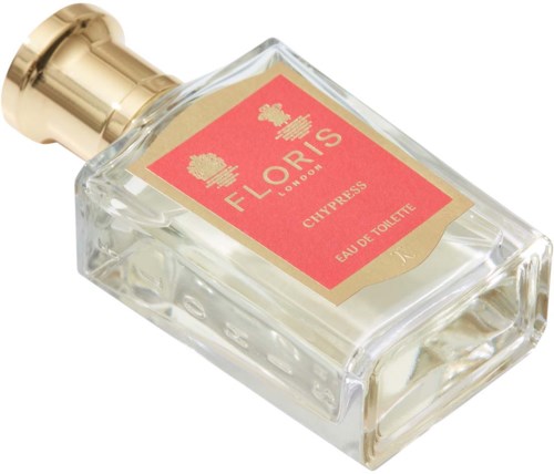 Een klein parfumflesje met een gouden dop en een rood label dat zegt Floris, Cypress, Eau de Toilette.