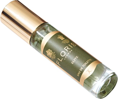 Een kleine parfumfles met een gouden dop en een donkergroene label met gouden details.