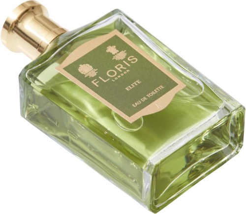 Een groen parfumflesje met een gouden dop, gemerkt 'Floris London Elite Eau de Toilette.'