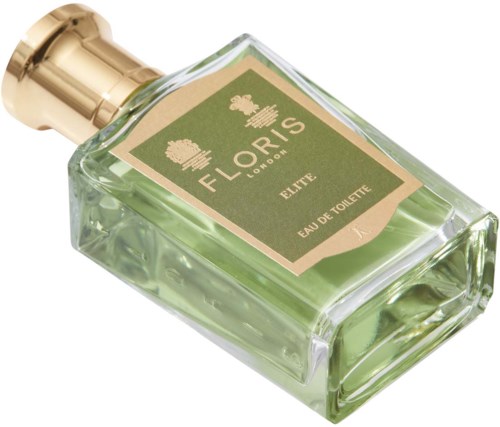 A glass perfume bottle with green liquid, gold cap, and a beige label saying 'Floris London, Elite, Eau de Toilette.'