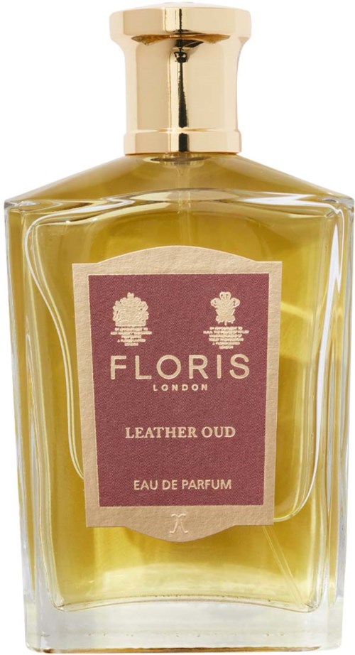 Eine Glasparfümflasche mit goldener Klappe enthält gelbgrüne Duftflüssigkeit. Das Etikett liest Floris London, Leather Oud, Eau de Parfum.
