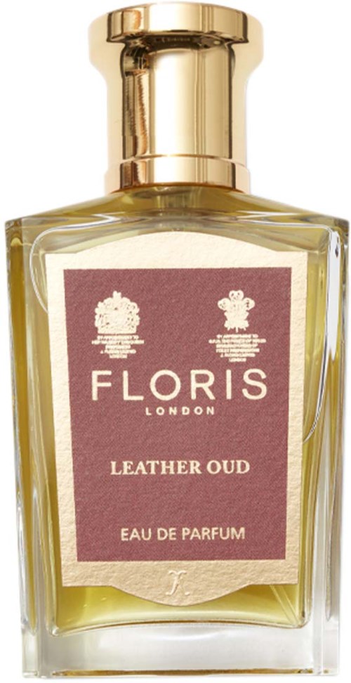 Een parfumfles met Floris Leather Oud, gouden dop en roze label, bevat eau de parfum.