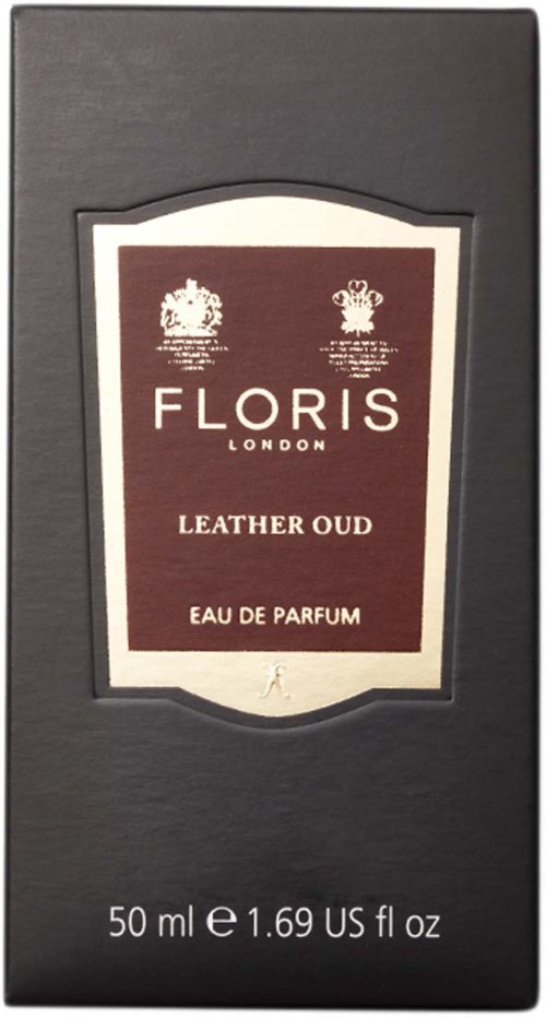 Een zwarte doos bevat een etiket voor Floris London Leather Oud Eau de Parfum, 50 ml, met gedetailleerde tekst en symbolen.