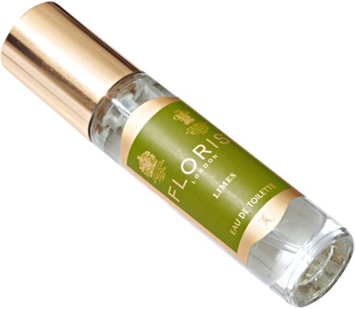 Eine kleine transparente Parfümflasche mit goldener Kappe und grünem Etikett, mit der Aufschrift "FLORES London Lime" Eau de Toilette.