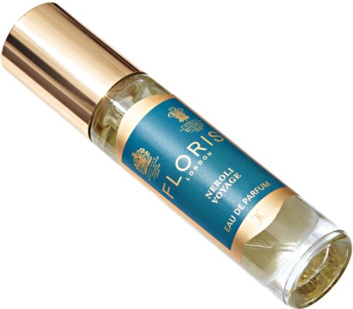 A small perfume bottle labeled 'ORIS' with a blue and gold design, containing Neroli Voyage fragrance.