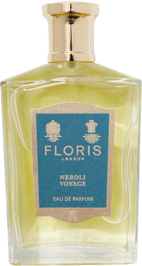 A glass perfume bottle with a gold cap, containing yellowish-green perfume, labeled 'Floris London Neroli Voyage.'