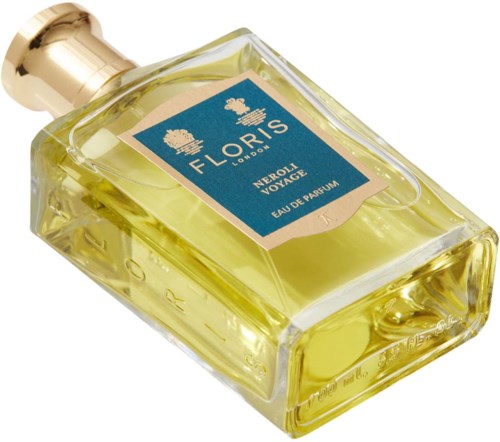 A perfume bottle with yellow liquid and a blue label, square shape with a gold cap.
