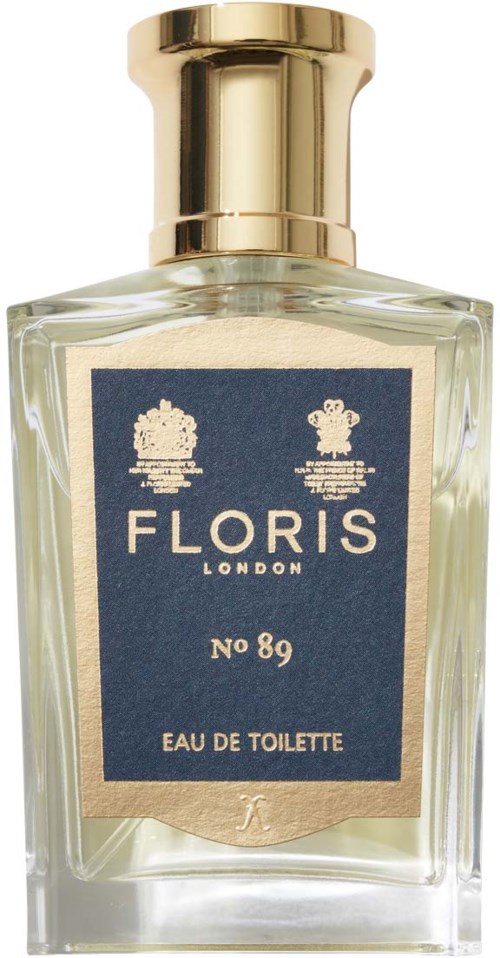 Przezroczysta butelka perfum z złotym korkiem, oznaczona 'Floris London No 89 Eau de Toilette.'