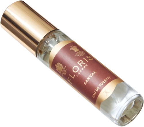 Een klein parfumflesje met een gouden dop en een bruin etiket met de tekst 'Eloris London Santal Eau de Toilette.'