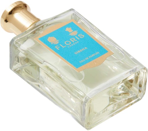 A perfume bottle with a gold cap and a blue label that says Fluoris Sirena.