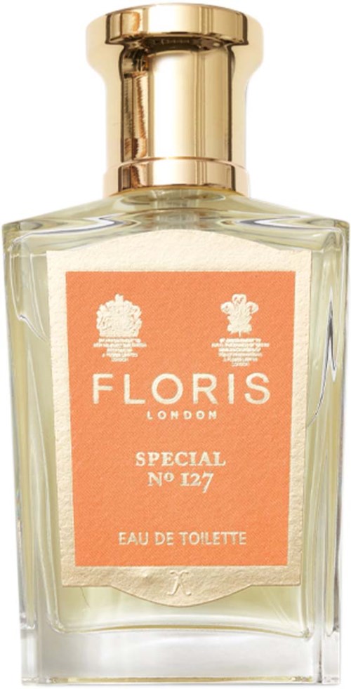 Przezroczysta butelka perfum z złotym korkiem, etykieta mówi Floris London Special No 127 Eau de Toilette.