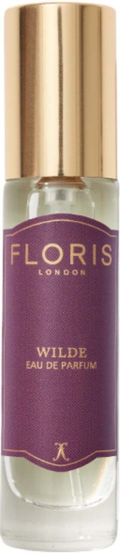 Eine kleine Parfüfflasche mit lila Etikett, goldener Kappe, beschriftet 'Floris Wilde Eau de Parfum' und ein kleines Logo.