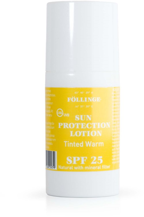 Witte fles met een gele label die zonbeschermingslotion zegt, SPF 25, getint warm.
