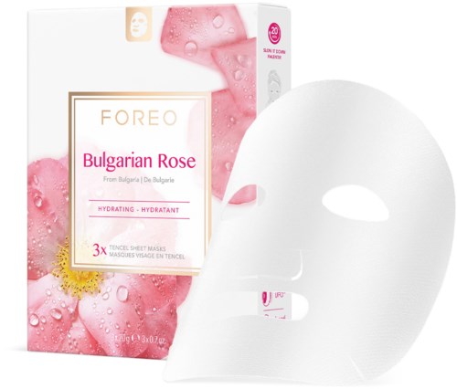 Een wit gezichtsmasker naast een doos met 'FOREO Bulgarian Rose', met roze en rozenafbeeldingen, indicating huidverzorgingsproduct.