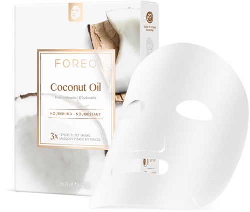 Een witte gezichtsmasker met gaten voor ogen en mond, verpakking zegt "Foreo Coconut Oil," en maskerinformatie.
