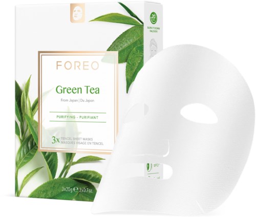 Verpakking met groene thee gezichtsmaskers, bladeren op de verpakking, en een masker buiten de doos.