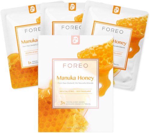 Vier huidverzorgingsmaskerpakketten met honing en bijenkolvbeelden, gelabeld 'FOREO Manuka Honey' en 'Revitalizing'.
