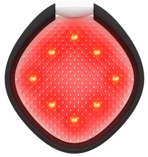 En enhet med många små lampor som lyser rött, ordnade i ett mönster, kanske en massage- eller laserbehandlingsenhet.