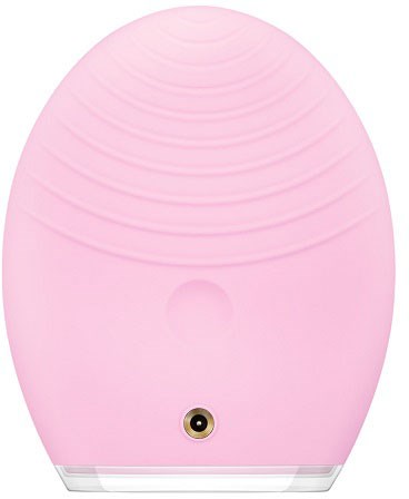 En rosa, ovalformad enhet med cirkulära ränder upptill och en liten ög-liknande funktion längst ner.