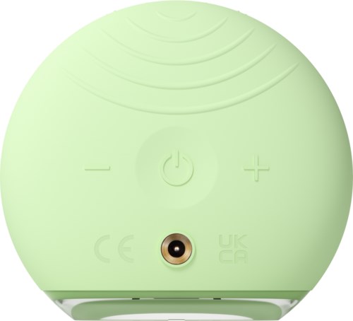 Dit is een ronde, lichtgroene apparaat met knoppen voor aan/uit, volume en een kleine ronde poort of sensor.