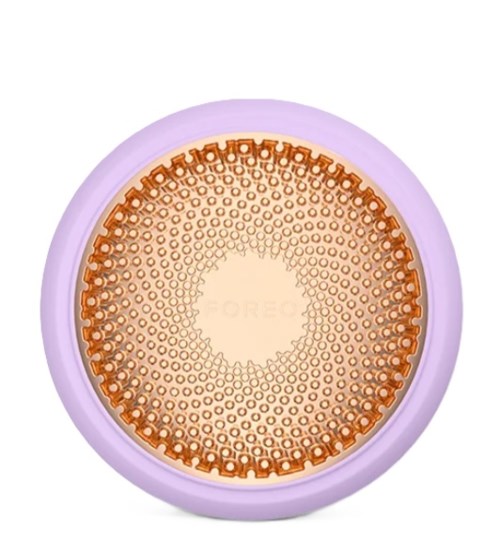 A circular object with a light purple border and a brown patterned center. The center has many small circles arranged in a circle.