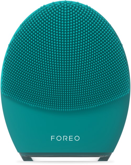 Een teal, eivormig apparaat met een getextureerd oppervlak en het woord 'FOREO' erop.