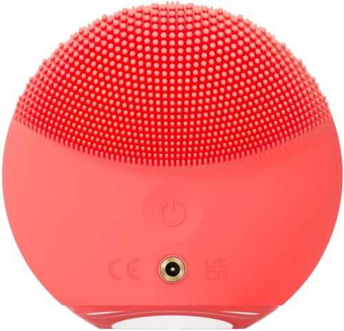 Een ronde roze speaker met kleine knopjes bovenaan en een aan/uit-knop in het midden.
