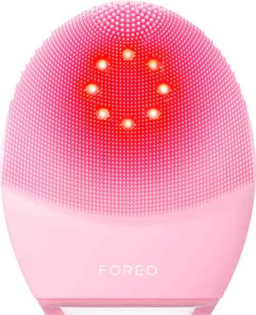 Een roze gezichtsschoonheidsapparaat met veel kleine lampjes en een cirkelvormig lichtpatroon bovenaan.