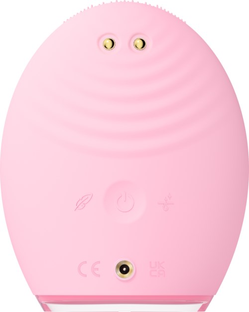 Een roze, ei-vormig apparaat met twee kleine ogen bovenaan en drie knoppen onderaan.